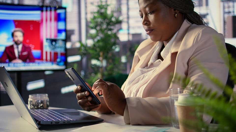 African professional managing digitized business invoicing and sales